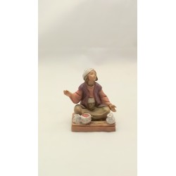Ragazzo seduto con semi cm 12