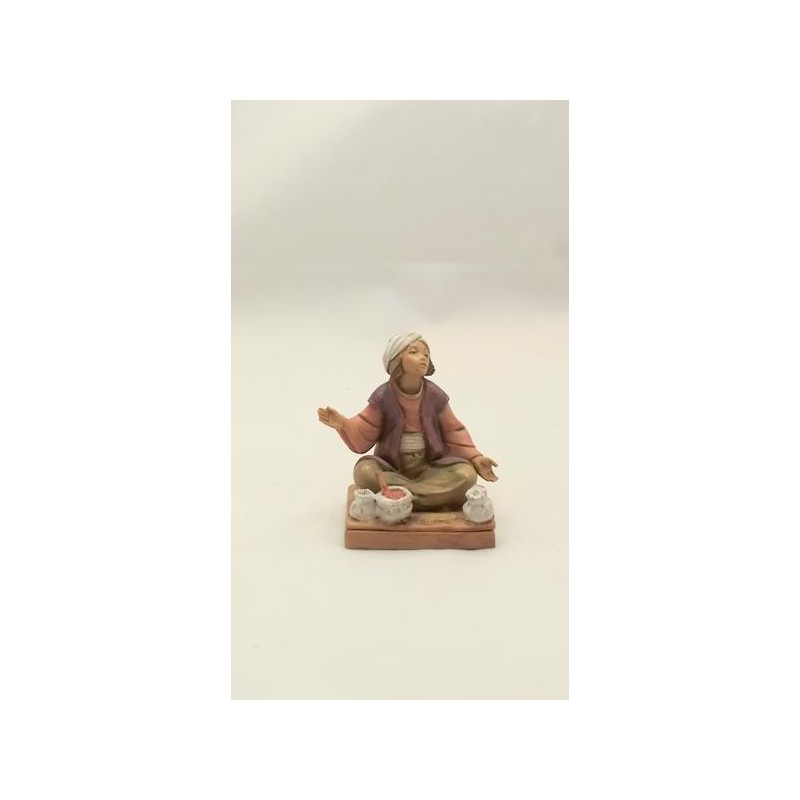 Ragazzo seduto con semi cm 12