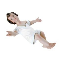 cm. 23 Bambino in resina con veste