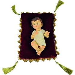 cm. 15 Bambino in resina su cuscino