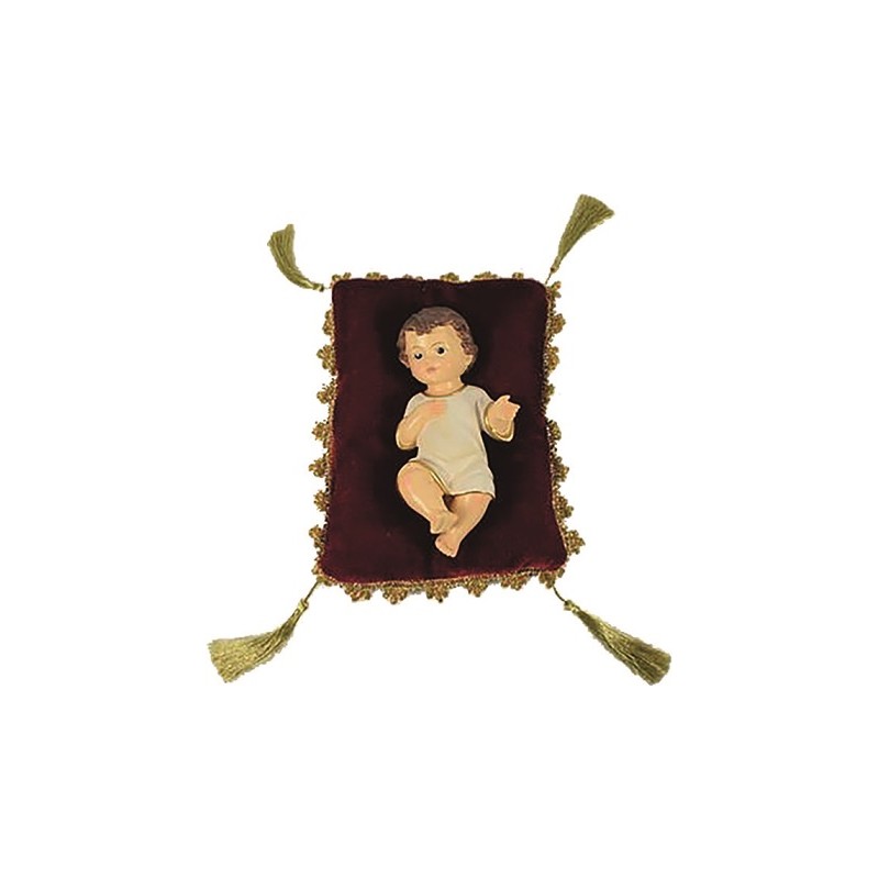 cm. 10 Bambino in resina su cuscino