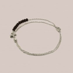 Braccialetto in metallo con grani di legno scorrevoli